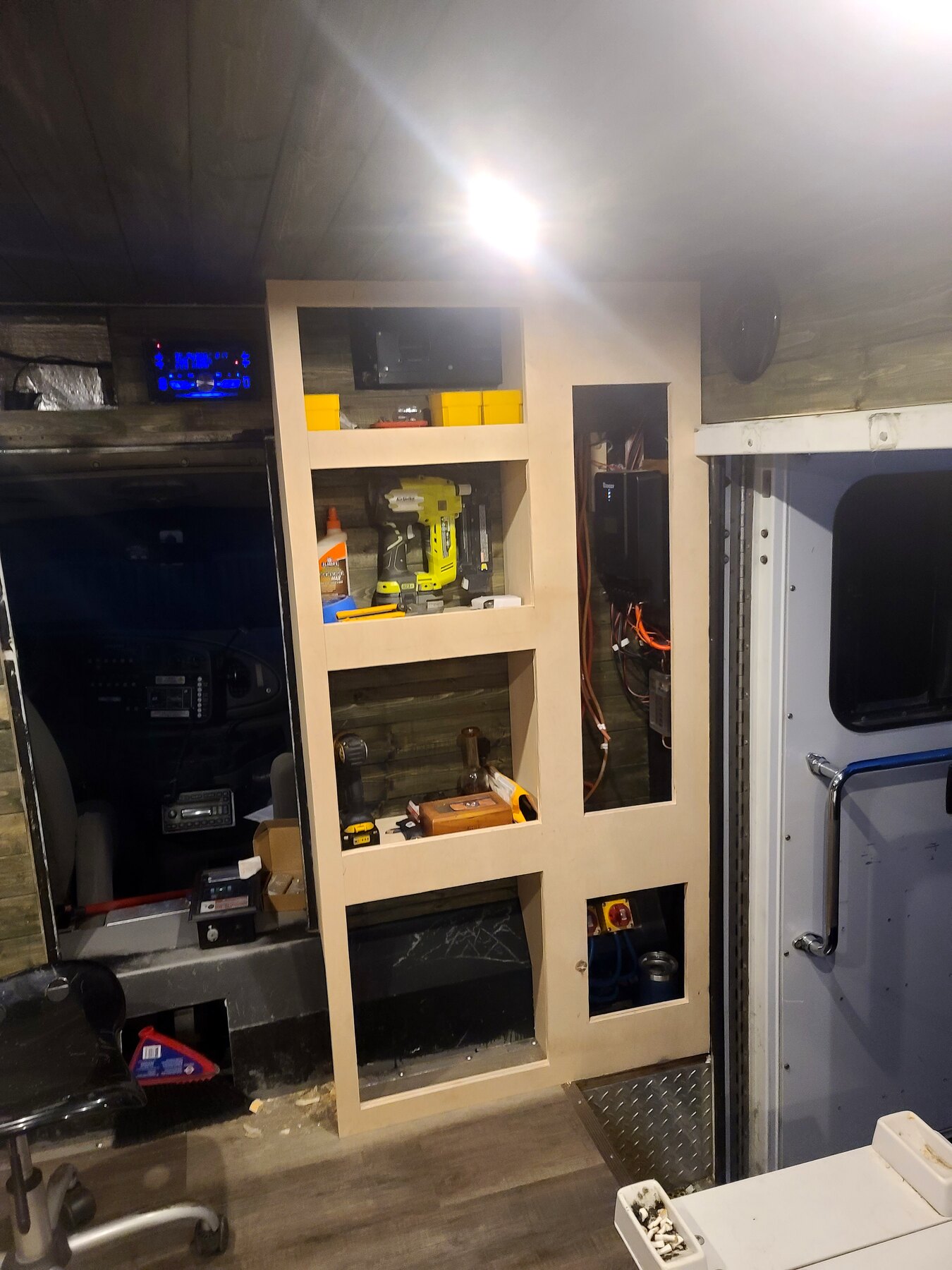 Built-in shelving and storage carcass inside a work area