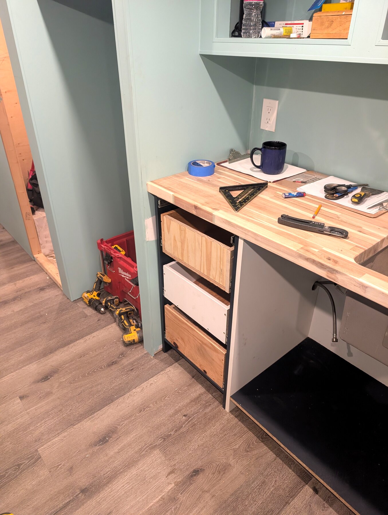 Built-in desk and drawers installed in a painted room