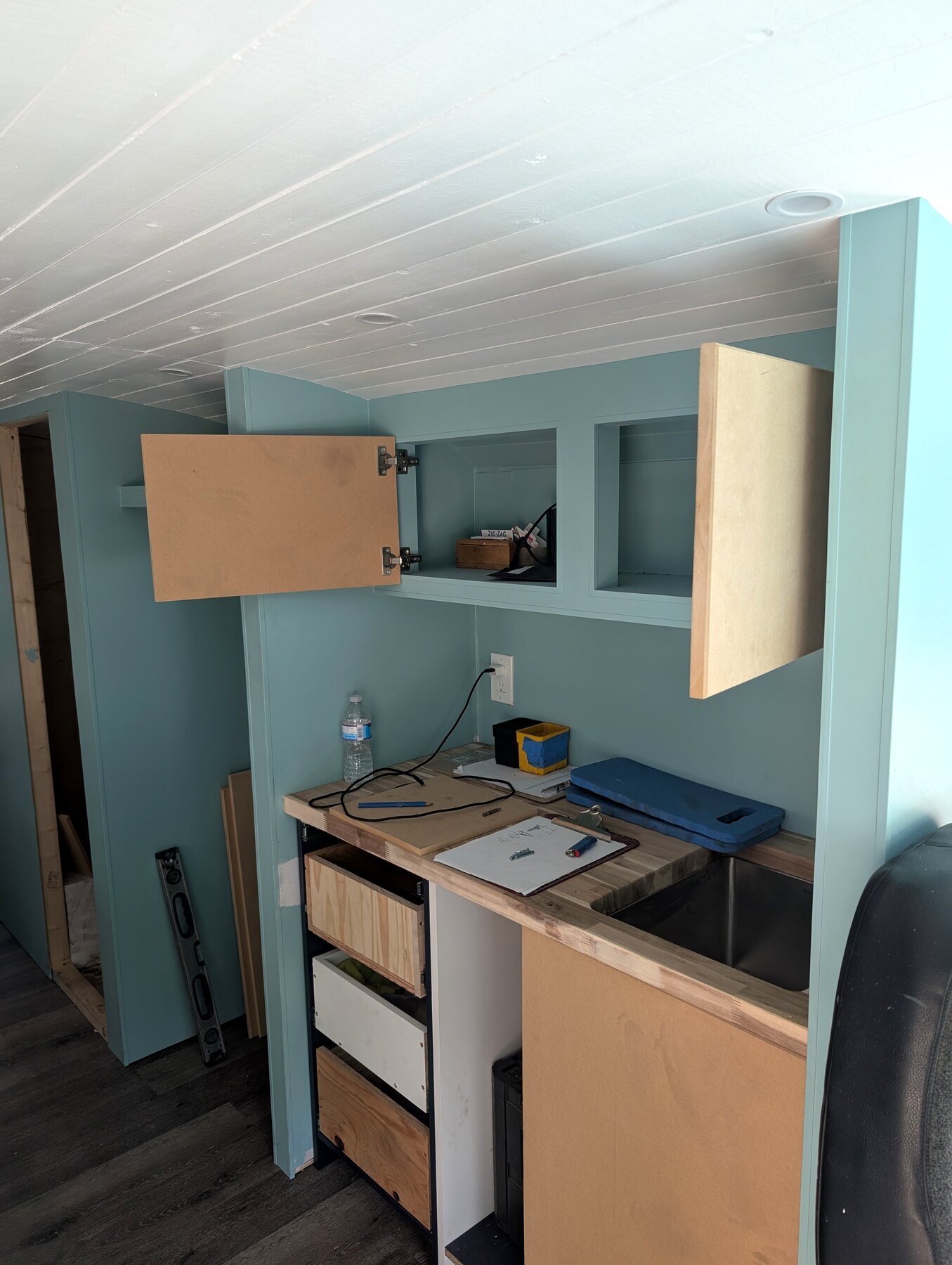 Built-in desk and wall storage in a painted room