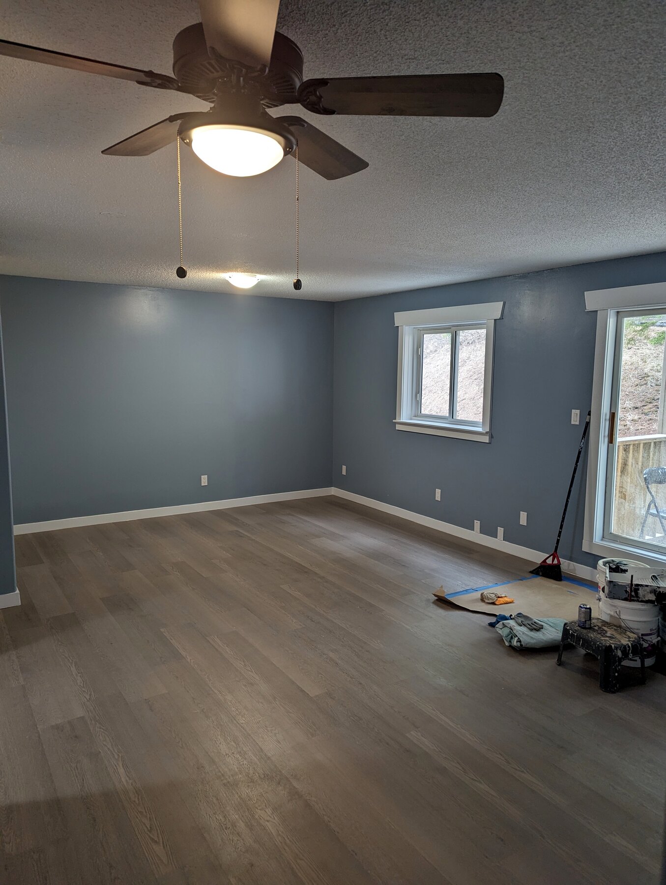 Clean interior room with finished flooring and painted walls