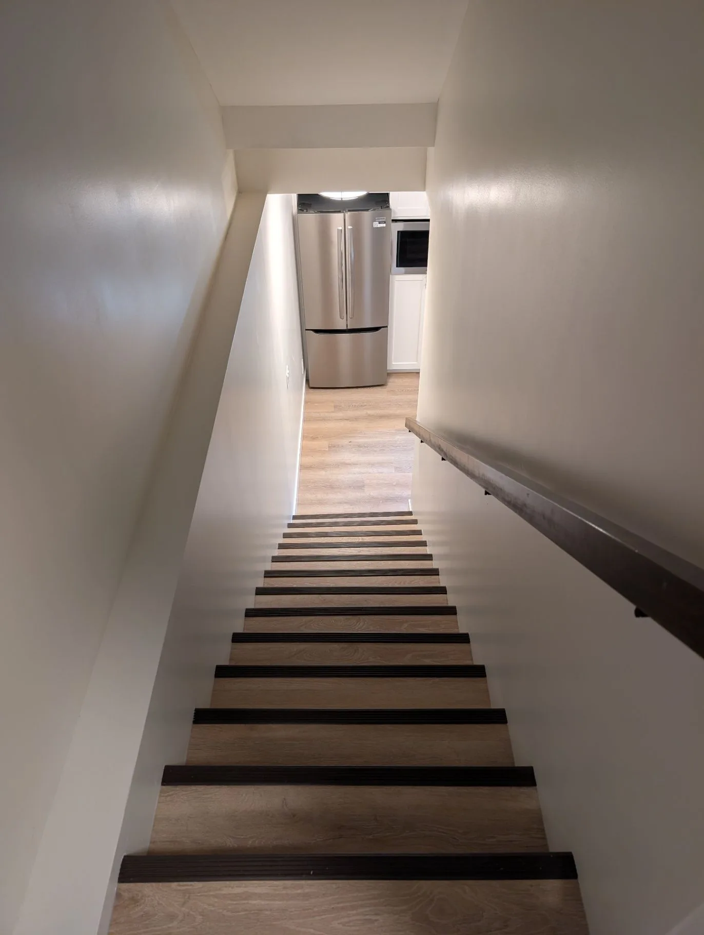 View up the basement stairs toward the kitchen