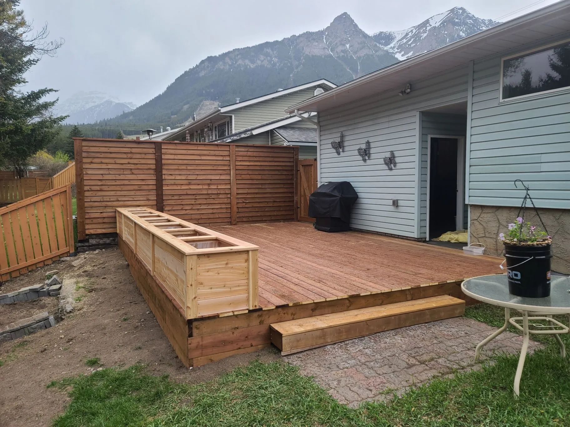 Deck renovation in the Elk Valley — completed deck with built-in planter