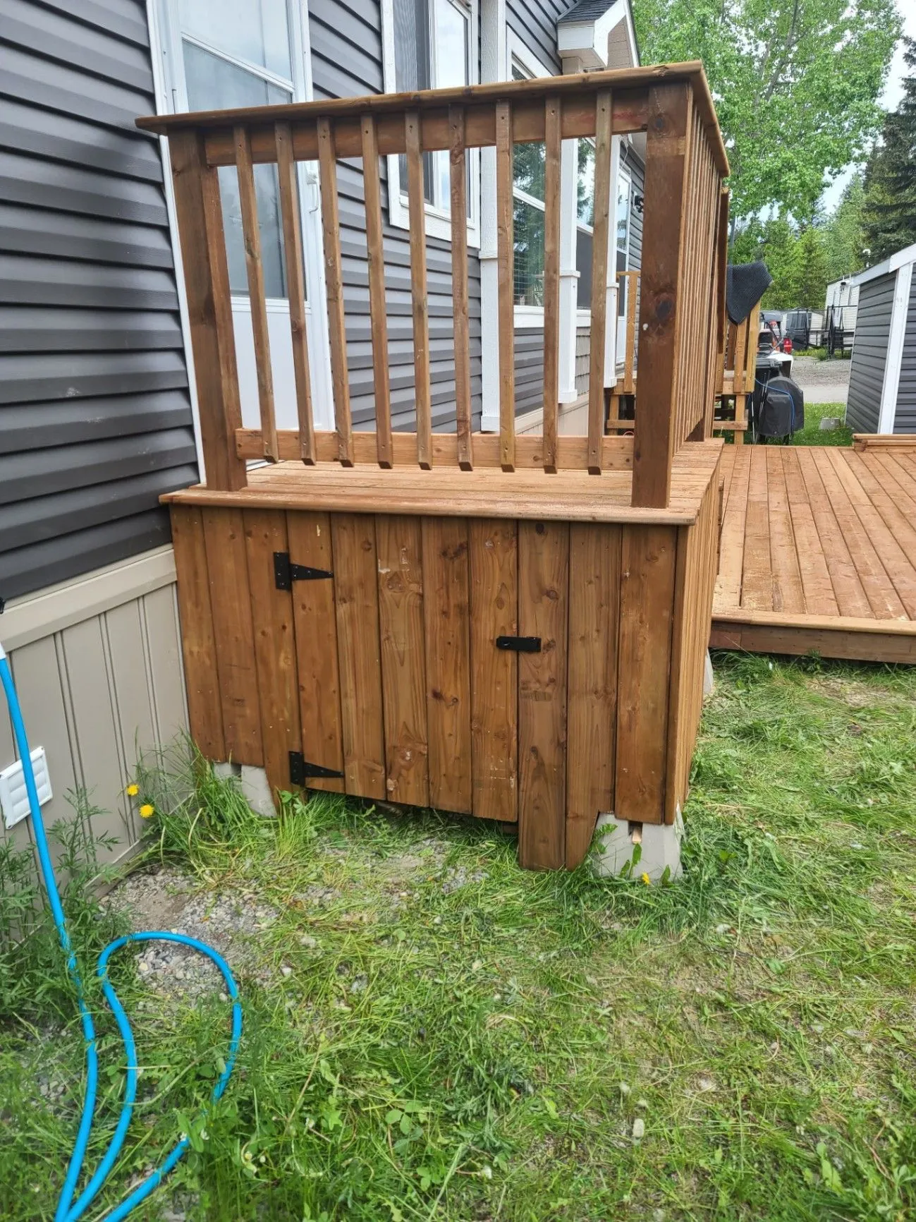 Deck-side storage structure and railing work
