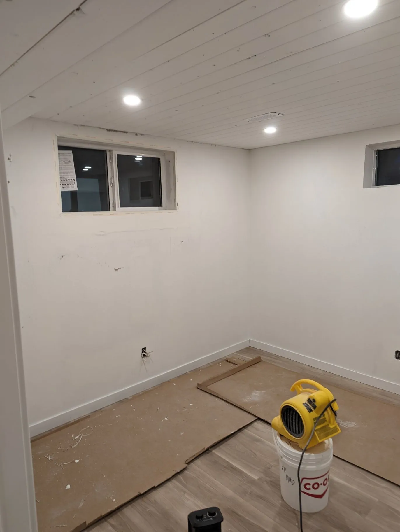 Interior room with new flooring and finishing equipment on site
