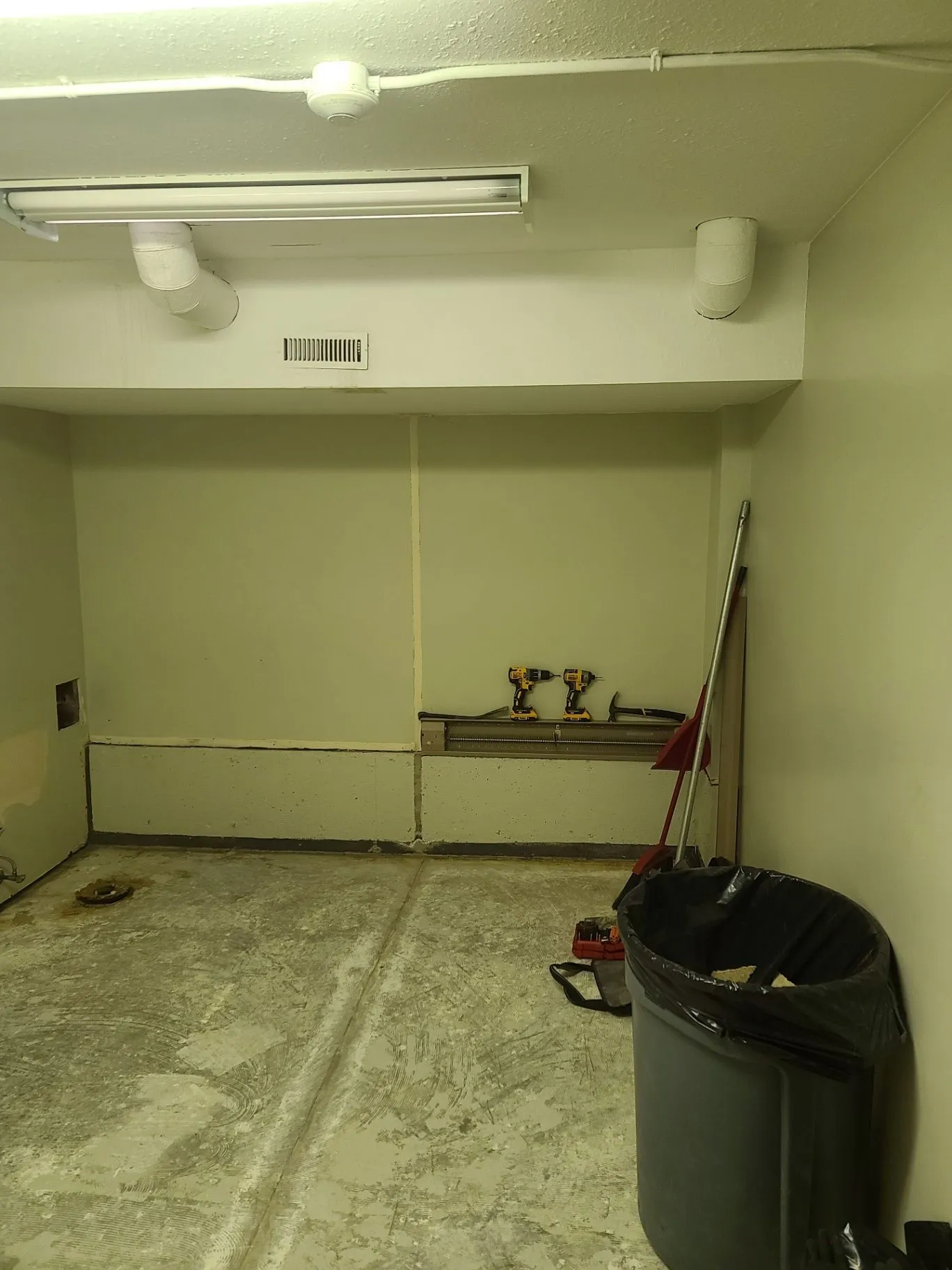 Interior wall and ceiling work with tools on site