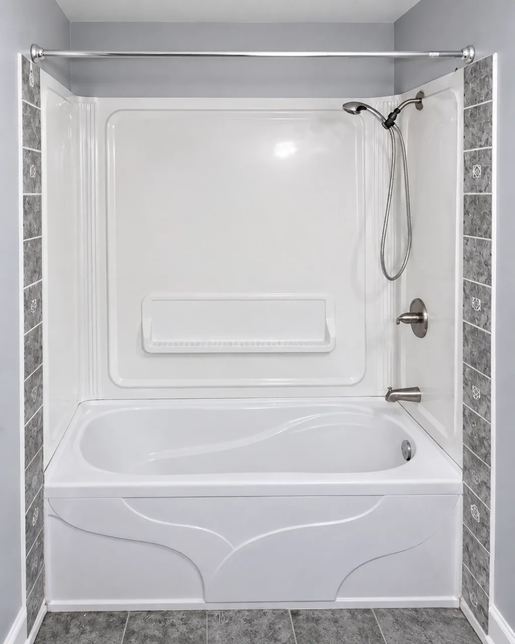 Bathroom tub installation in progress with tools visible