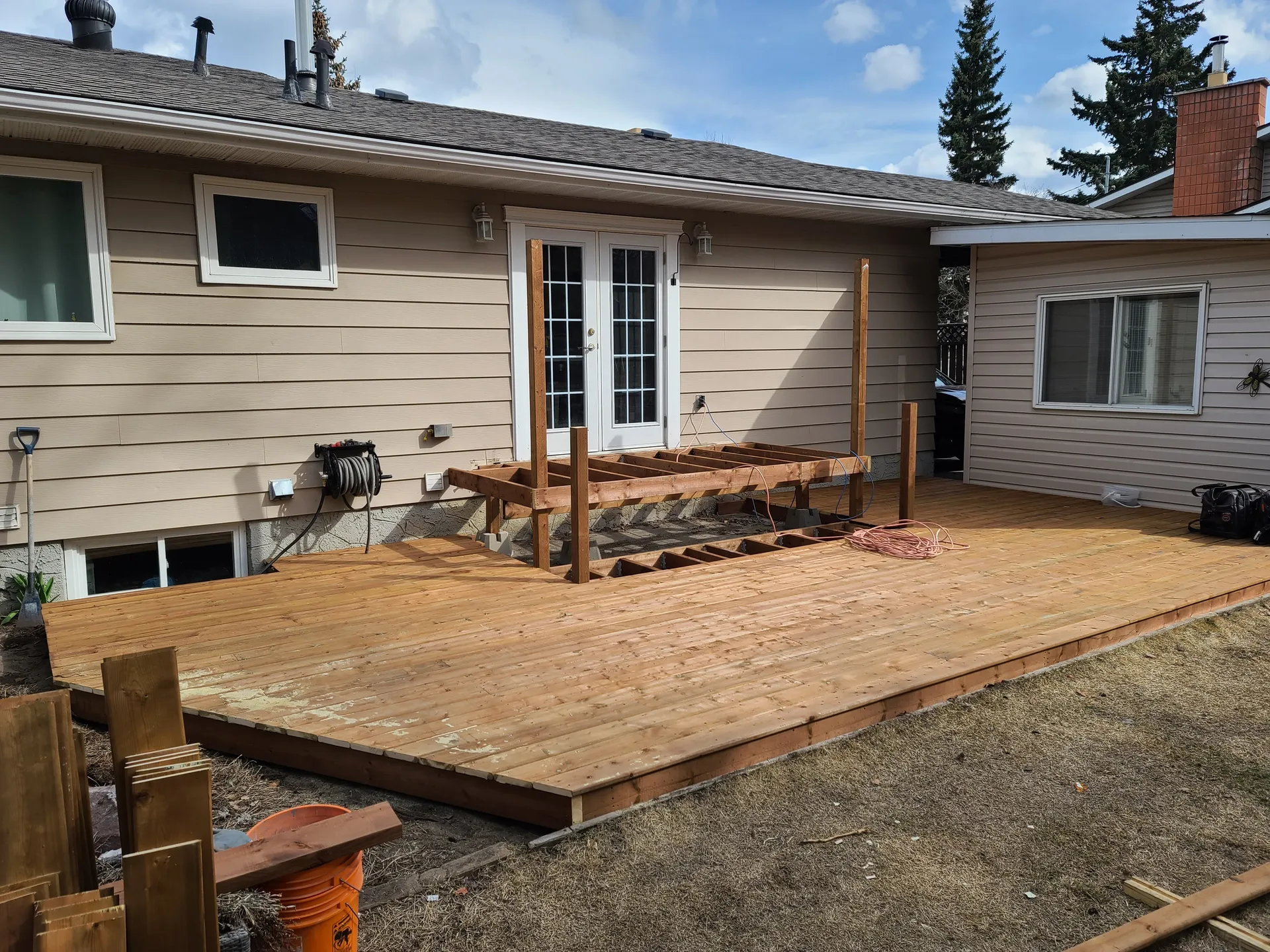 Deck boards taking shape beside the house