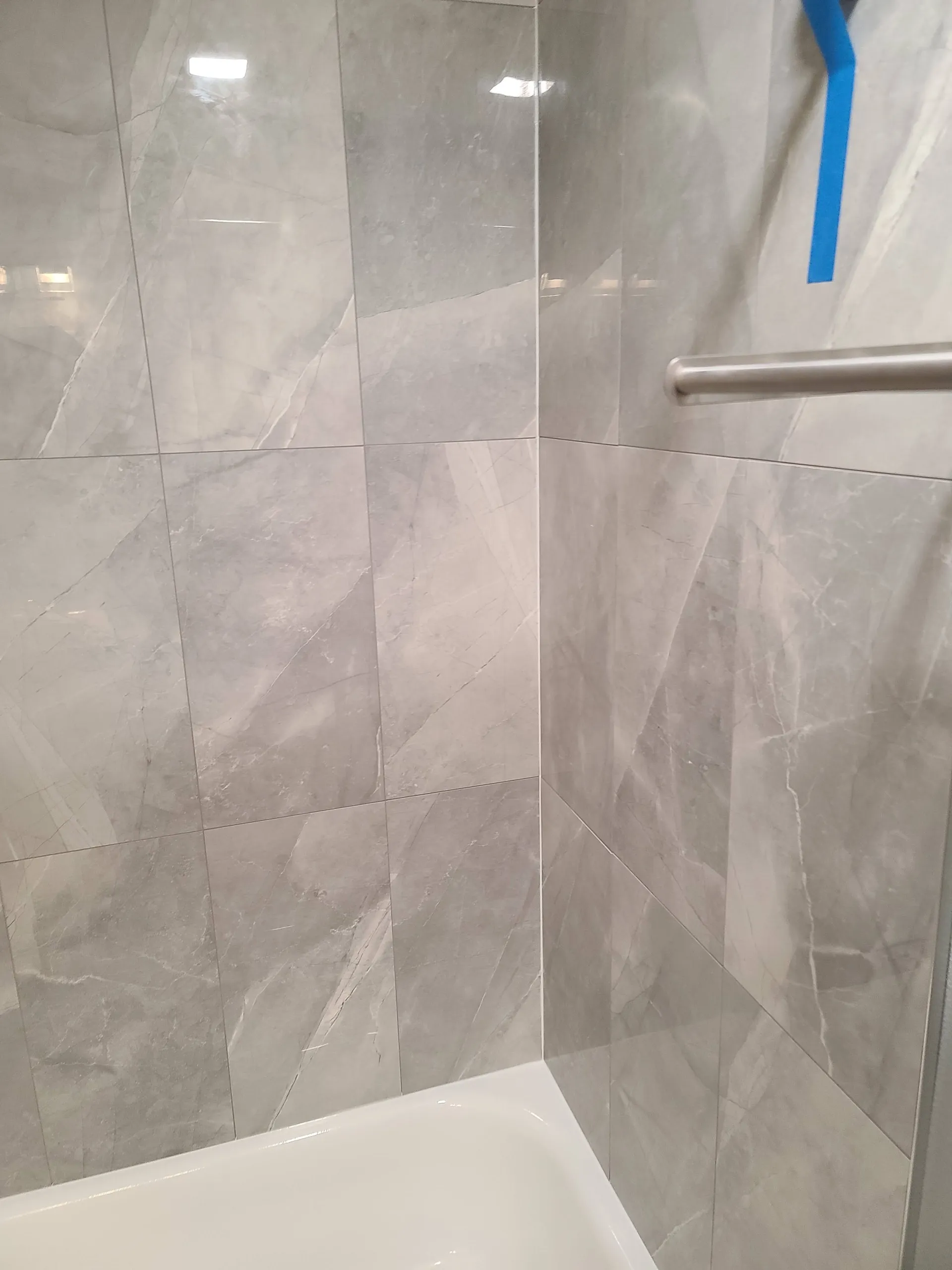 Second finished view of the grey tile tub surround